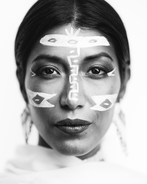 Interesting close shot black and white portrait photo of women with face paints. Interesting close shot black and white portrait photo of women with face paints.